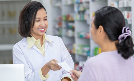 Picture of a pharmacist with a client